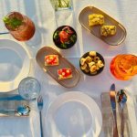 EdenRooftopRestaurant-Valza-06 Aperitif table from above with a spritz, a mint cocktail, tomato bruschetta, taralli and small bites